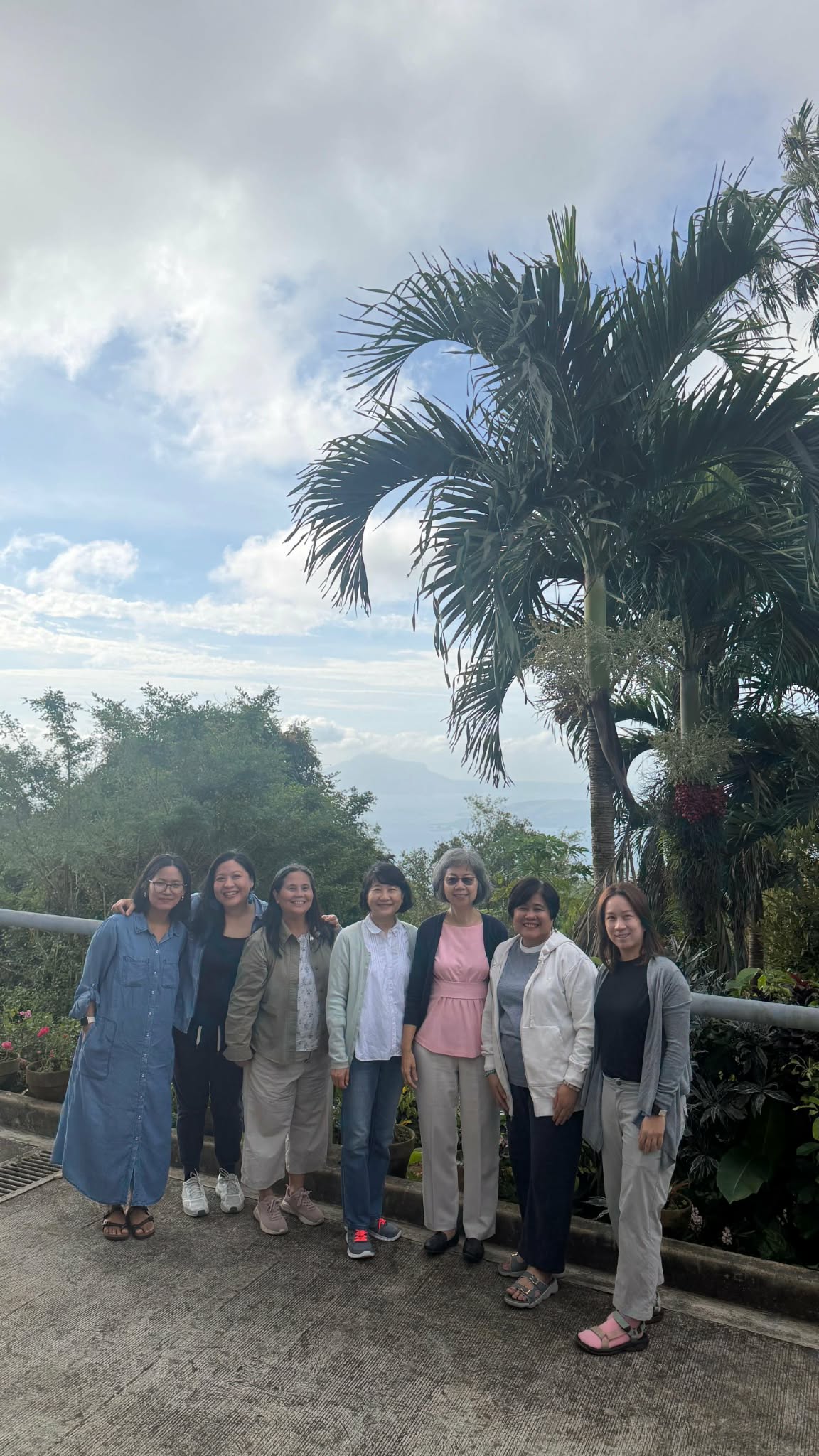 Team fellowship photo overlooking Tagaytay landscape
